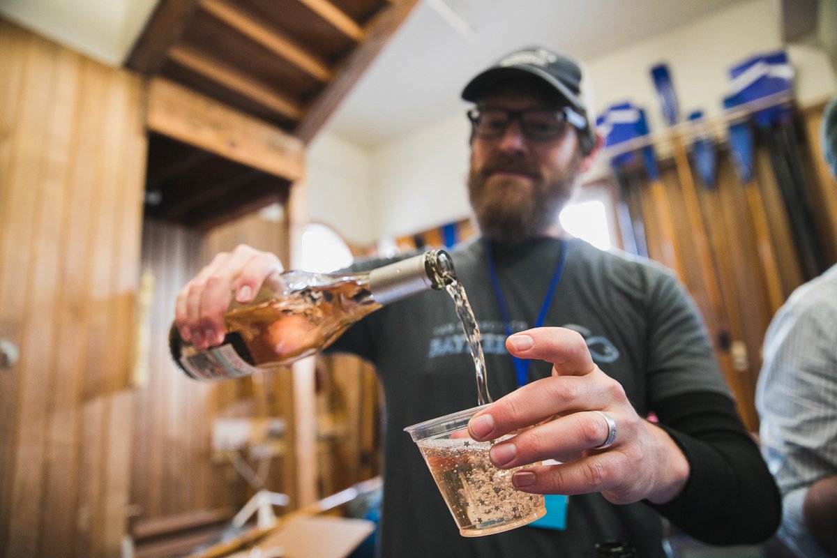 Bartender pouring Rosé for the Bay into a glass