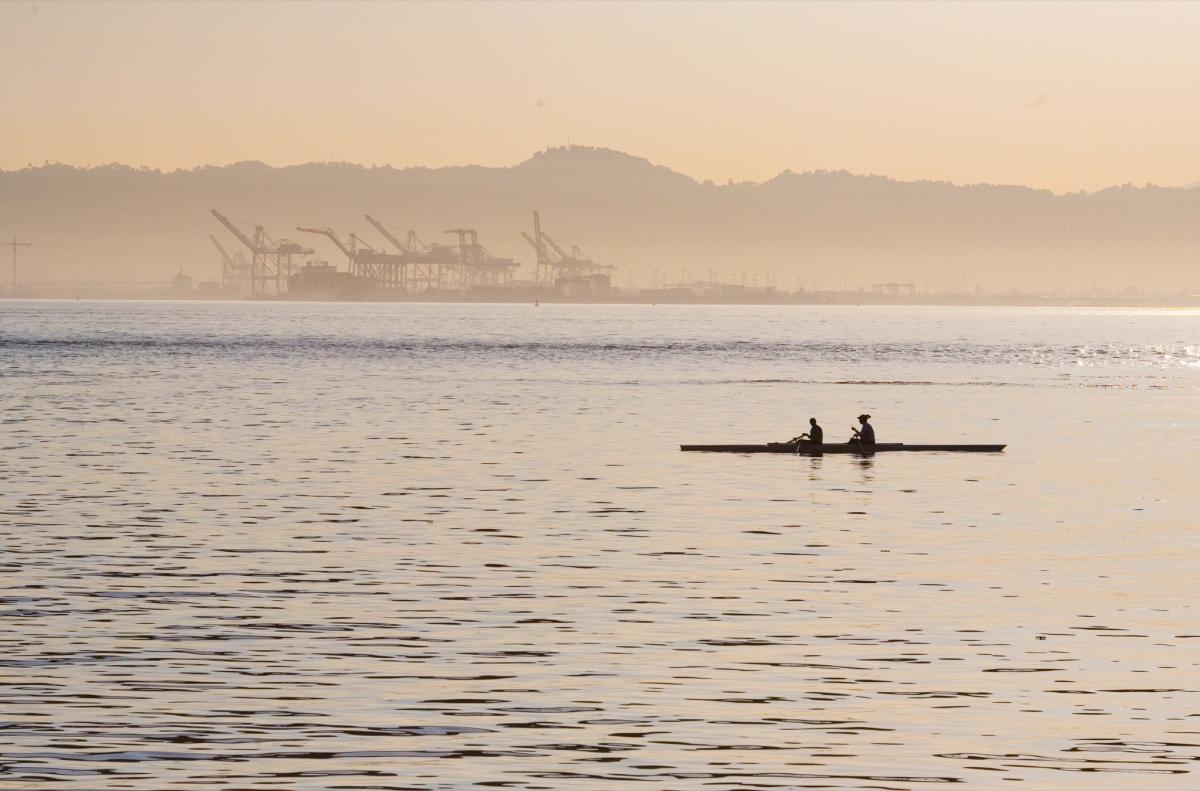 Kayakers on the Bay with ship loading in the background