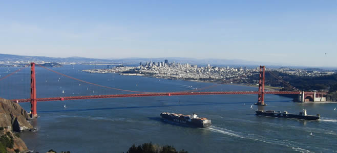 Ships navigating under the Golden Gate Bridge