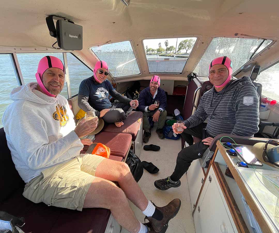 Relay swimmers aboard the boat