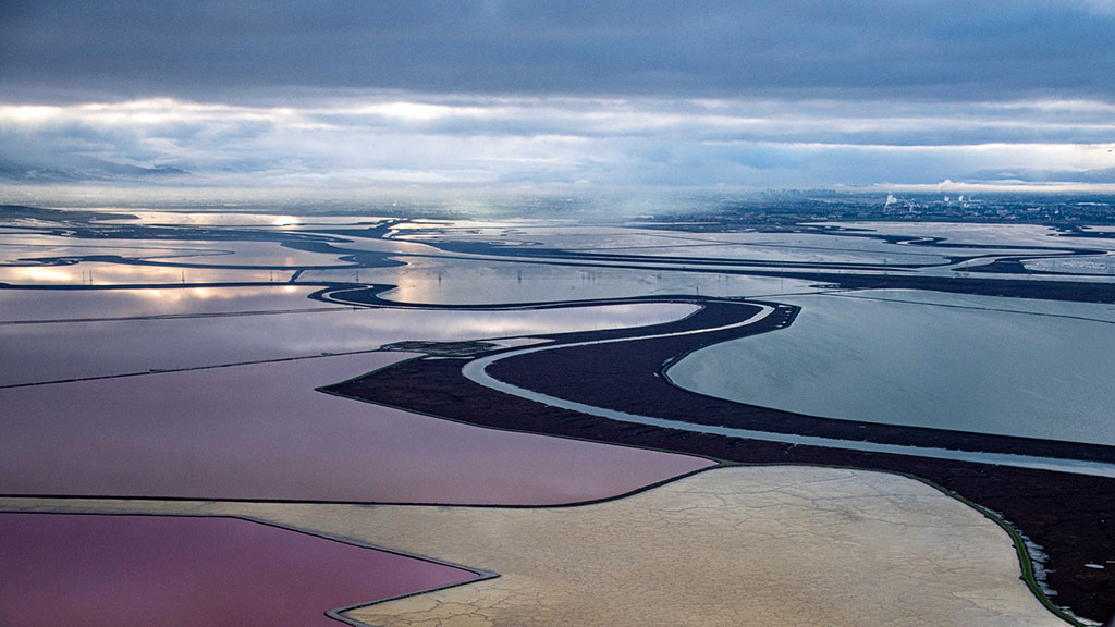 South Bay salt ponds and cloudy sky from the air