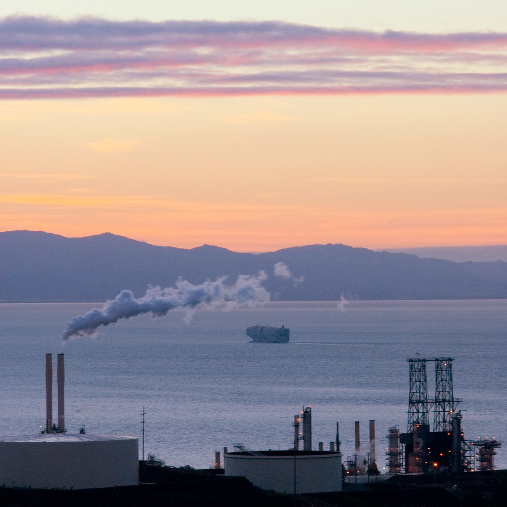 Sunset over the Bay with refinery in foreground